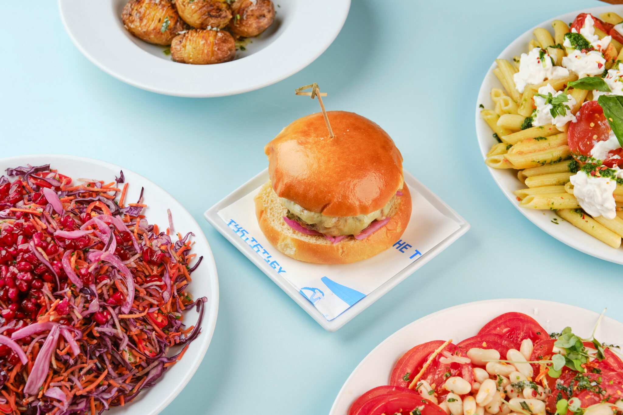 A burger and salads